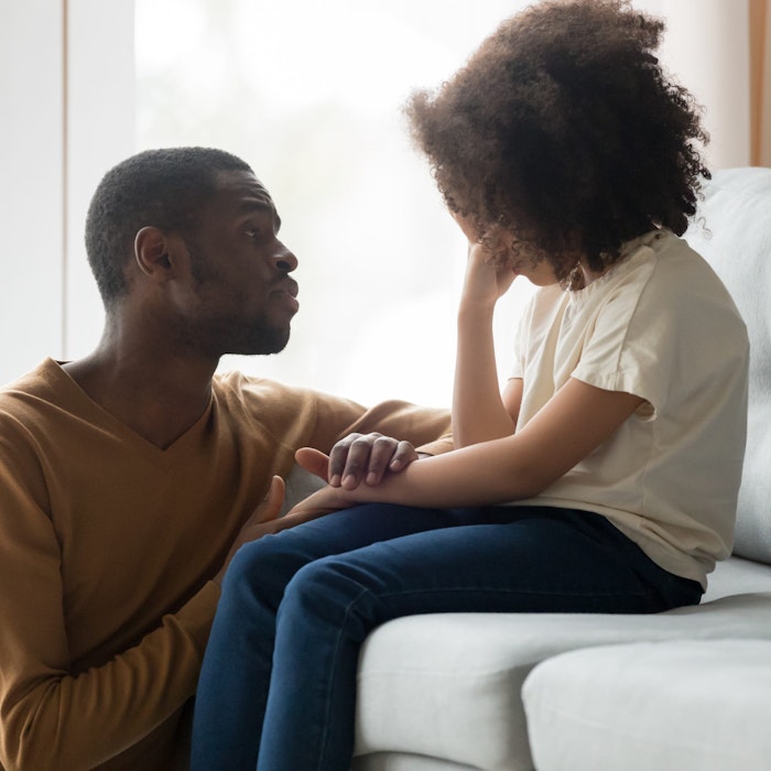 dad comforting crying child