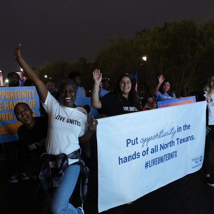 group of volunteers marching in parade